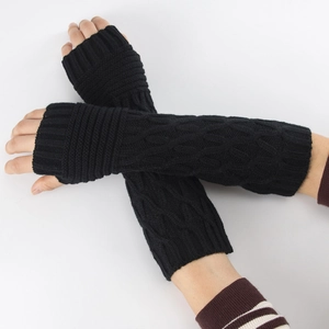 Close-up of black cable-knit arm warmers featuring fingerless long sleeve design