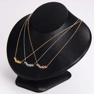 Irregular vertical bar pendant necklace in gold, silver, and rose gold finishes