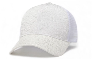 Detail of white mesh baseball cap featuring intricate floral lace and breathable fabric