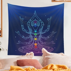Bedroom wall decor showing a blue chakra meditation tapestry behind a bed setup