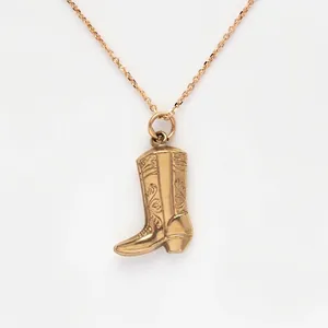 Retro gold cowboy boot pendant necklace in vintage western style for women and men