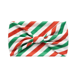 Detail view of red, green, and white striped Christmas bow headband made of soft fabric