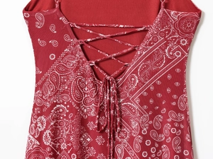Detail of cross-back lace-up design on red bandana print dress with tie-up closure