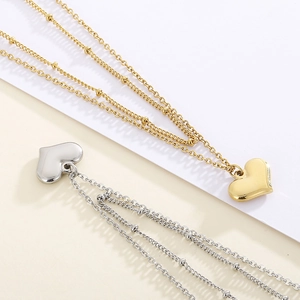 Minimalistische zweilagige Perlenkette mit poliertem Herzanhänger in Gold und Silber