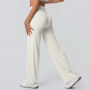 Detail view of high-waisted off-white wide-leg yoga pants with premium slimming peach-seam