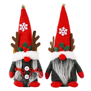 Set of two Christmas reindeer gnomes with red snowflake hats and grey plush beards