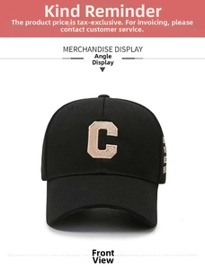 Detailed close-up of the beige chenille letter C embroidery on a black cotton baseball cap