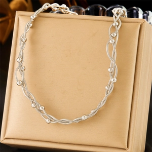 Silver stainless steel twisted chain necklace with beads in a golden jewelry gift box
