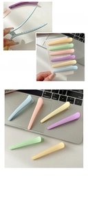 Detail of matte macaron candy colored hair clips set with smooth snap opening feature