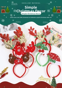 Flat lay of festive Christmas headbands with glitter antlers and mini Santa hats
