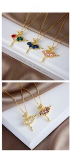 Close-up of ballet dancer pendant necklace with vibrant multi-color zircon stones