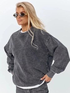 Detail view of ribbed neckline and washed cotton texture on vintage charcoal grey sweatshirt