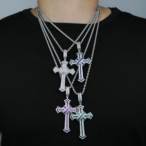 Detail of four hip hop cross necklaces with white, blue, purple, and green zircons
