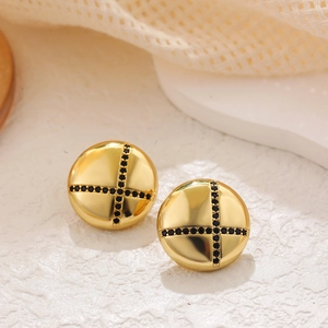 Detailed close-up of gold round stud earrings featuring cross-patterned black zircons