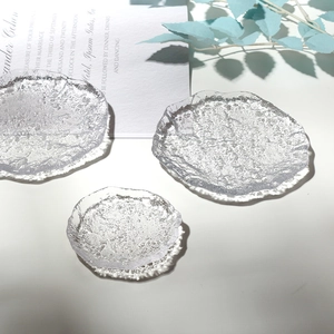 Close-up of irregular textured glass coasters with unique ice-cracked pattern detail