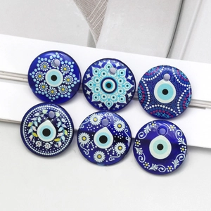 Detail view of six unique evil eye glass charms for DIY jewelry making accessories