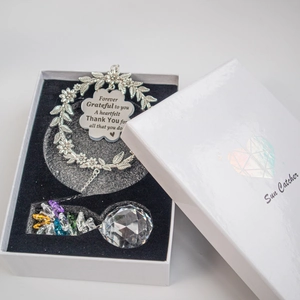Detail of wreath suncatcher gift set with engraved heart tag and crystal ball