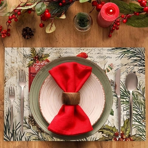 Festive Christmas placemat with red berries and pine branches on a rustic wooden table