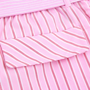 Pink and white striped straight leg pants featuring a pocket and belt detail