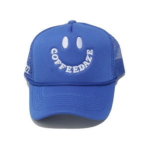 Macro detail of breathable blue trucker hat featuring white smile emoji embroidery
