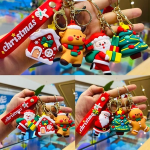 Cartoon Christmas keychains featuring Santa, reindeer, and tree with soft silicone straps
