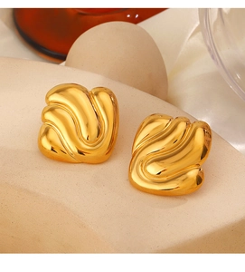 Detailed close-up of 18K gold plated wavy square earrings on minimalist stone display