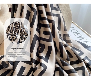 Macro shot of digital printed silk scarf with geometric pattern and smooth texture