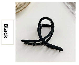 Close-up of matte black metal shark hair claw clip with strong spring and grip