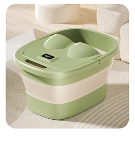 Detail of green folding foot bath bucket featuring lid with integrated digital temperature display