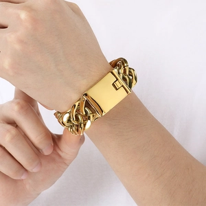 Men's gold-plated stainless steel Cuban link bracelet with a wide buckle on wrist