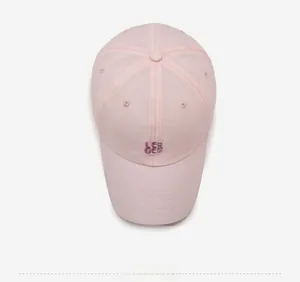 Top down view of a light pink quick-dry baseball cap with letter embroidery and top button