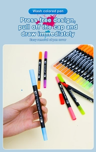 Macro shot of double-tipped watercolor markers with flexible brush and fine point nibs