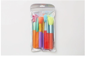 Rainbow makeup brush set with seven pieces in a holographic iridescent clear pouch