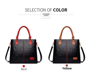 Detail of embossed letter texture and leather finish on red and yellow tote bags