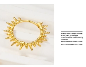 Detail of gold sunburst beaded earring made of skin-friendly international standard 925 silver
