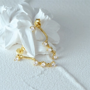 Macro view of S925 hallmark on gold plated sterling silver earrings with zircons