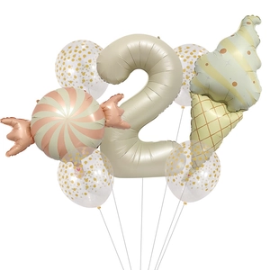 Detail of dessert theme party set with cream number 2 and ice cream foil balloons