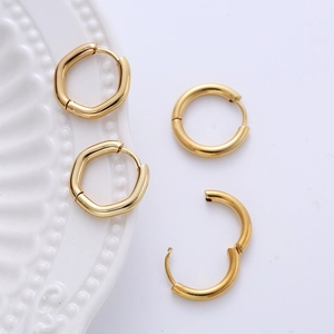 Detailed view of minimalist gold hoop earrings in round and geometric hexagonal styles
