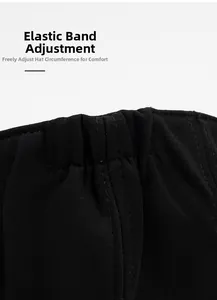 Detail of the adjustable elastic band on a black cotton beret for custom head size fitting