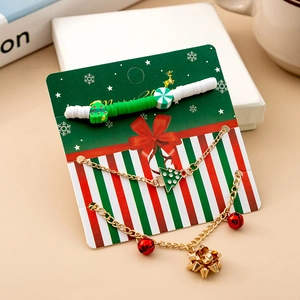Detailed Christmas charm bracelet with festive reindeer and bell icons on gift card