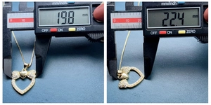 Close-up of golden heart pendant with bow and pearls showing 22.4mm measurement