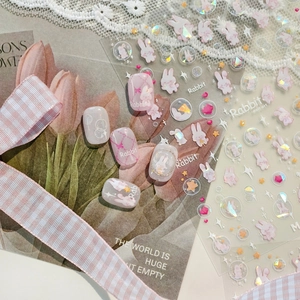 Cute pink rabbit nail art stickers with 3D star patterns on a transparent backing