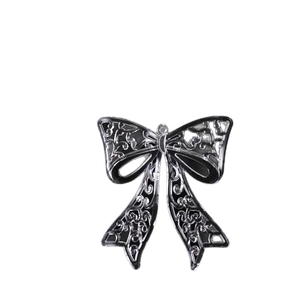 Elegant black acrylic hollow-out snowflake bow pendant with glossy finish for decor