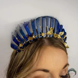 Detail of blue lapis lazuli stones and golden leaf decorations on handmade crown headband