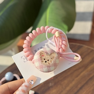 Pink telephone wire hair tie with fabric button featuring a cute puppy design