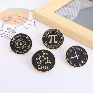 Set of four black and gold scientific enamel pins featuring atom, pi, and chemical formulas