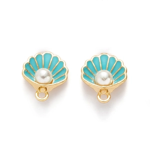 Detail of gold seashell charms with blue enamel finish and white pearl center on white base