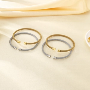 Stack of gold and silver 4mm mesh woven cable cuff bracelets in stainless steel
