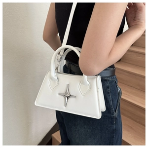 White trapezoid handbag with silver star stud detail and dual round top handles