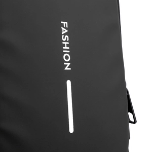 Close-up of matte black water-resistant fabric with white FASHION print detail